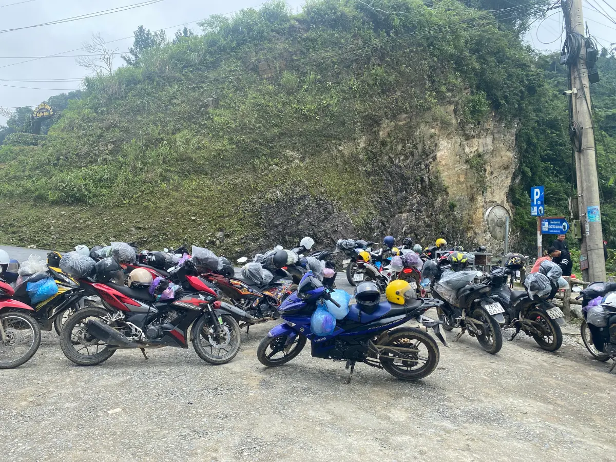 30 motorbikes in a parking lot on the Ha Giang loop