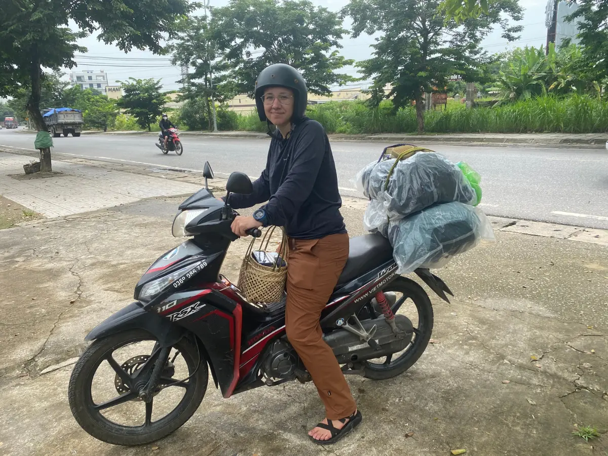 Person backpacking on a semi-automatic motorbike in Vietnam