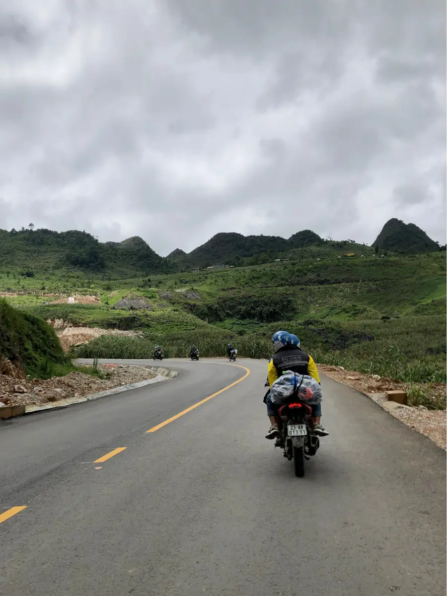 Ha Giang Vision Tour guides bring our small group through the windy roads as easy riders on manual motorbikes.